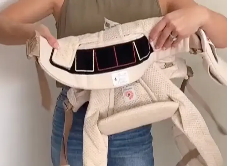 Close-up of the thick, padded lumbar support waistband on the Ergobaby Omni 360 carrier.